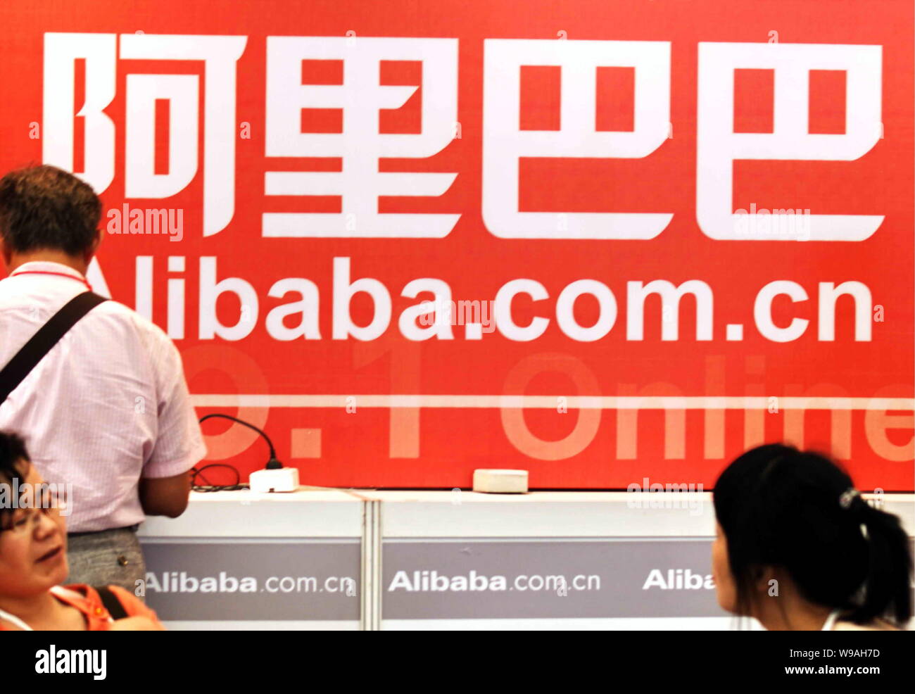 --FILE--Chinese visitors are seen at the stand of Alibaba during an exhibition in Shanghai, China, 19 May 2009.   Chinas largest e-commerce firm Aliba Stock Photo