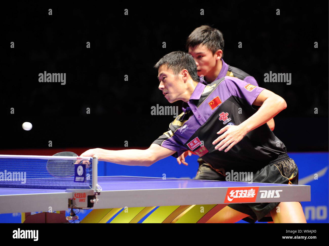 Chinas Wang Liqin, front, and Chen Qi compete against their teammates Ma Lin and Xu Xin in the final of the mens doubles of the 2010 China Open Table Stock Photo