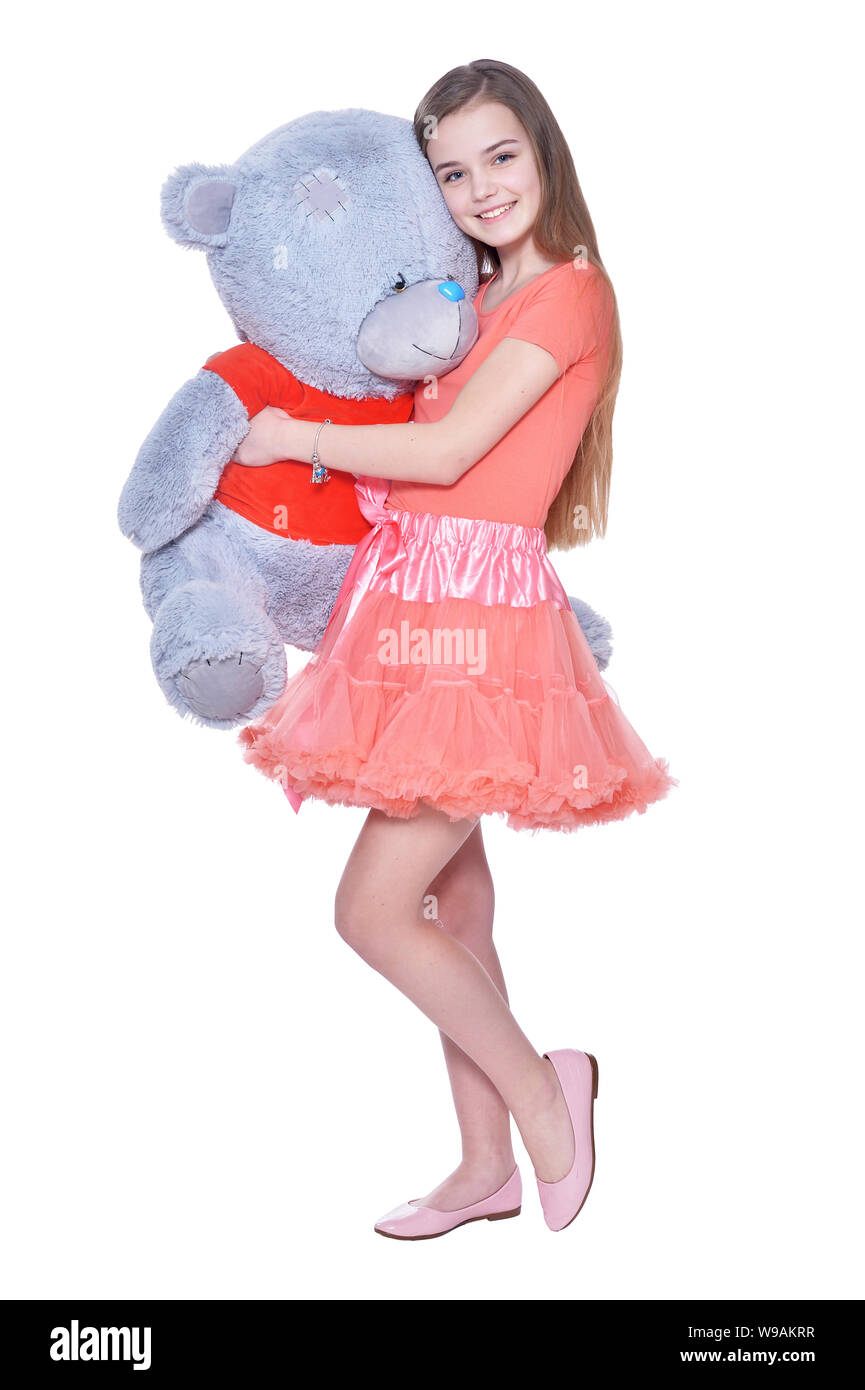 Happy little girl with toy bear posing Stock Photo
