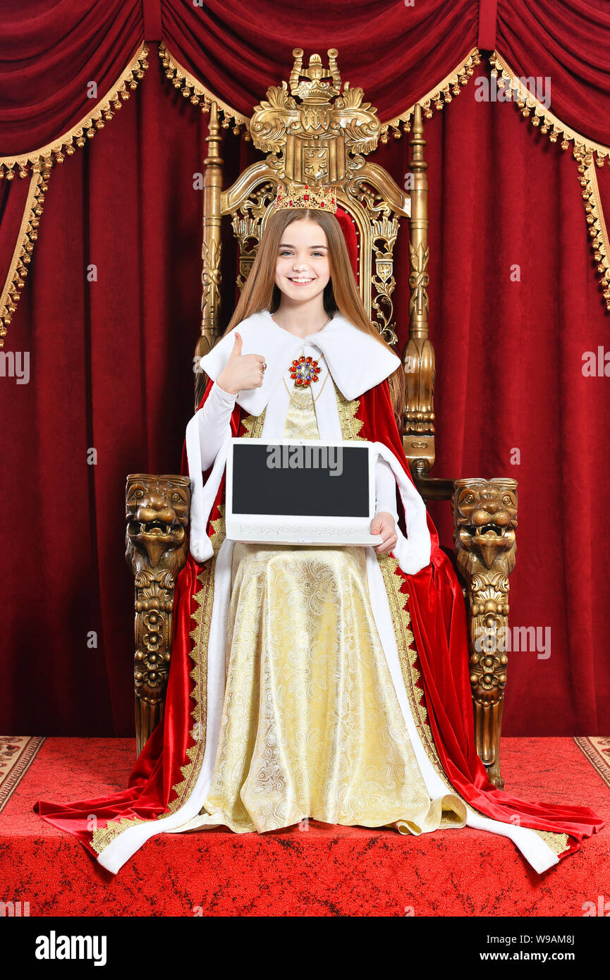 Portrait of beautiful teen girl holding laptop Stock Photo - Alamy