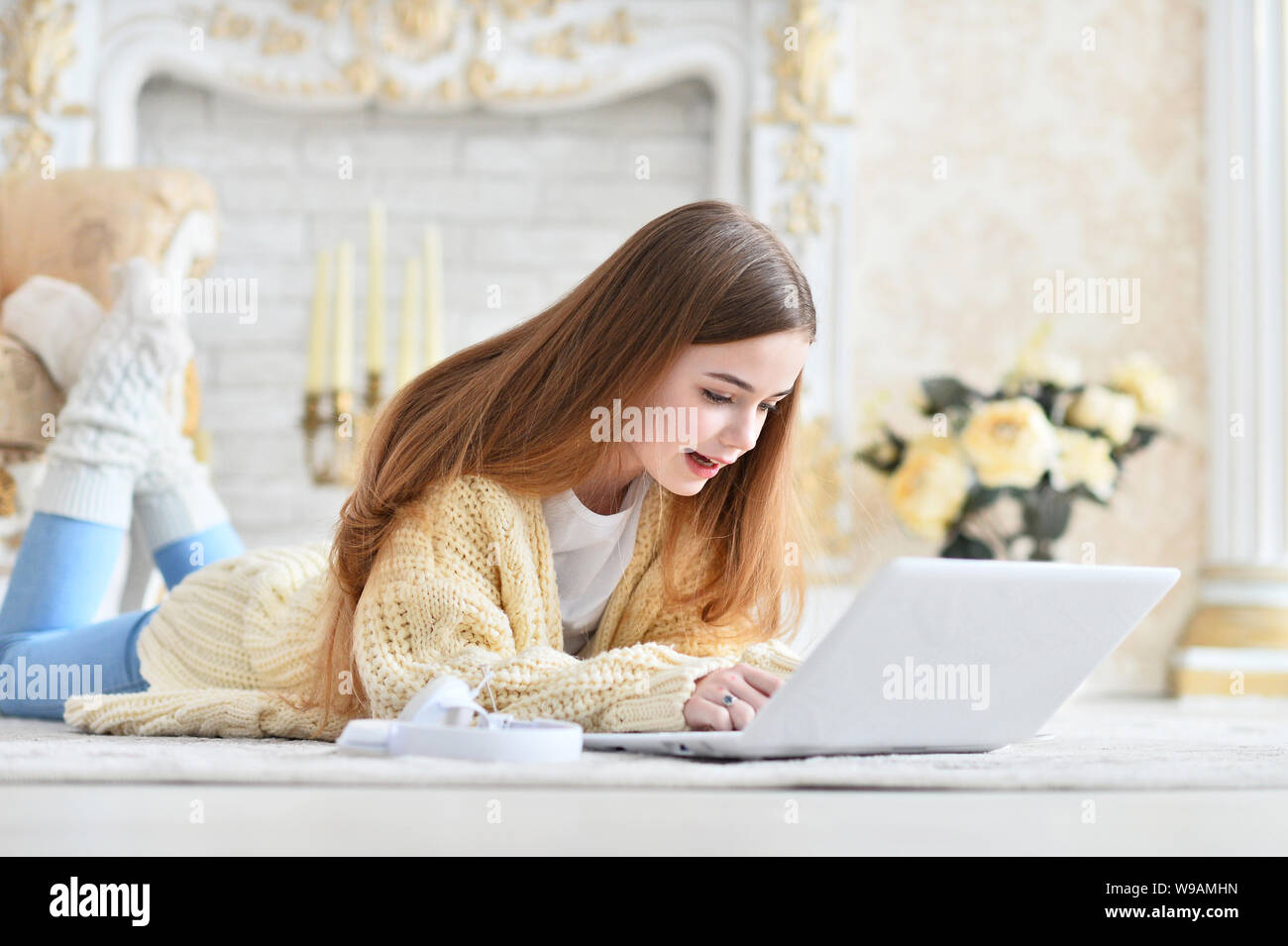 Portrait of beautiful teen girl lying on floor Stock Photo - Alamy