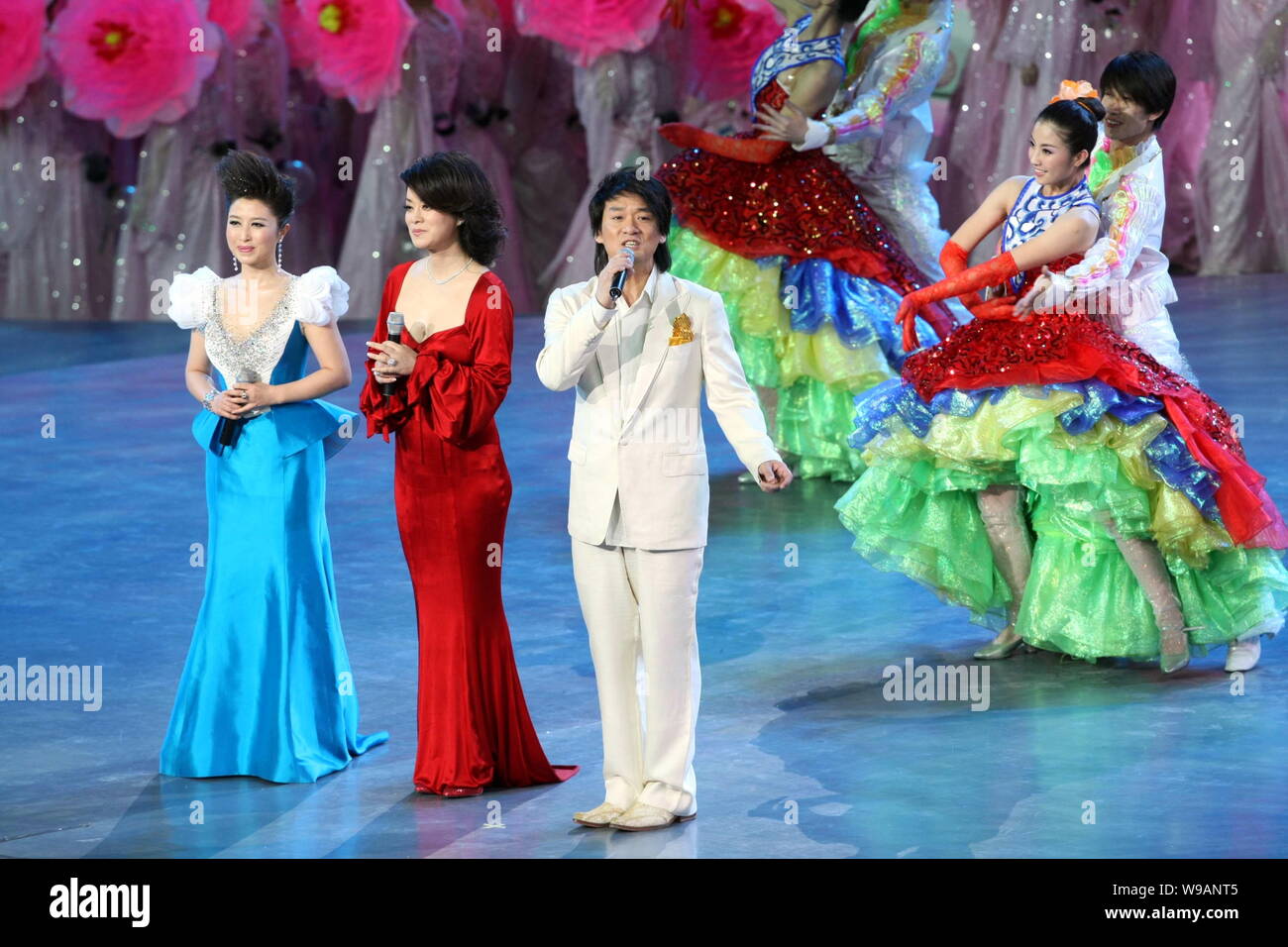 (From left) Chinese singers Liu Yuanyuan, Mao Amin and Taiwanese singer Emil Chau (Chau Wakin) sing during the opening ceremony of the World Expo 2010 Stock Photo