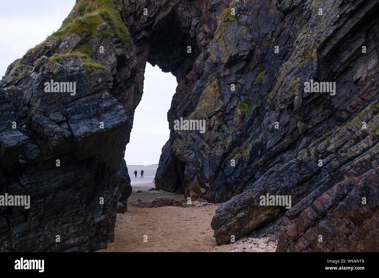The famous Needles Eye rock arch near Sandyhills, Dumfries and Gallway on the Solway Firth, Scotland. Stock Photo