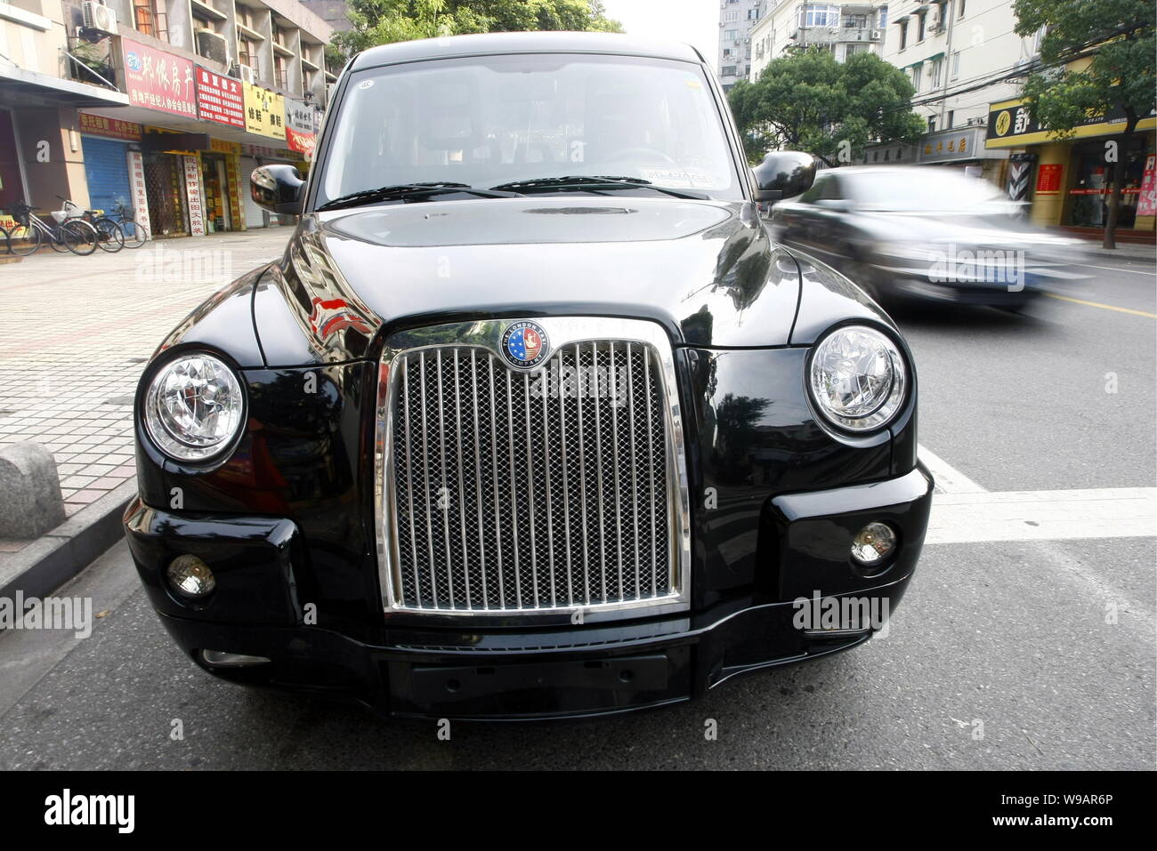 A Geely TX4 is seen in a street in Shanghai, China, July 21, 2010.   Manganese Bronze Holdings Plc, maker of the iconic London black cab, wanted to ti Stock Photo