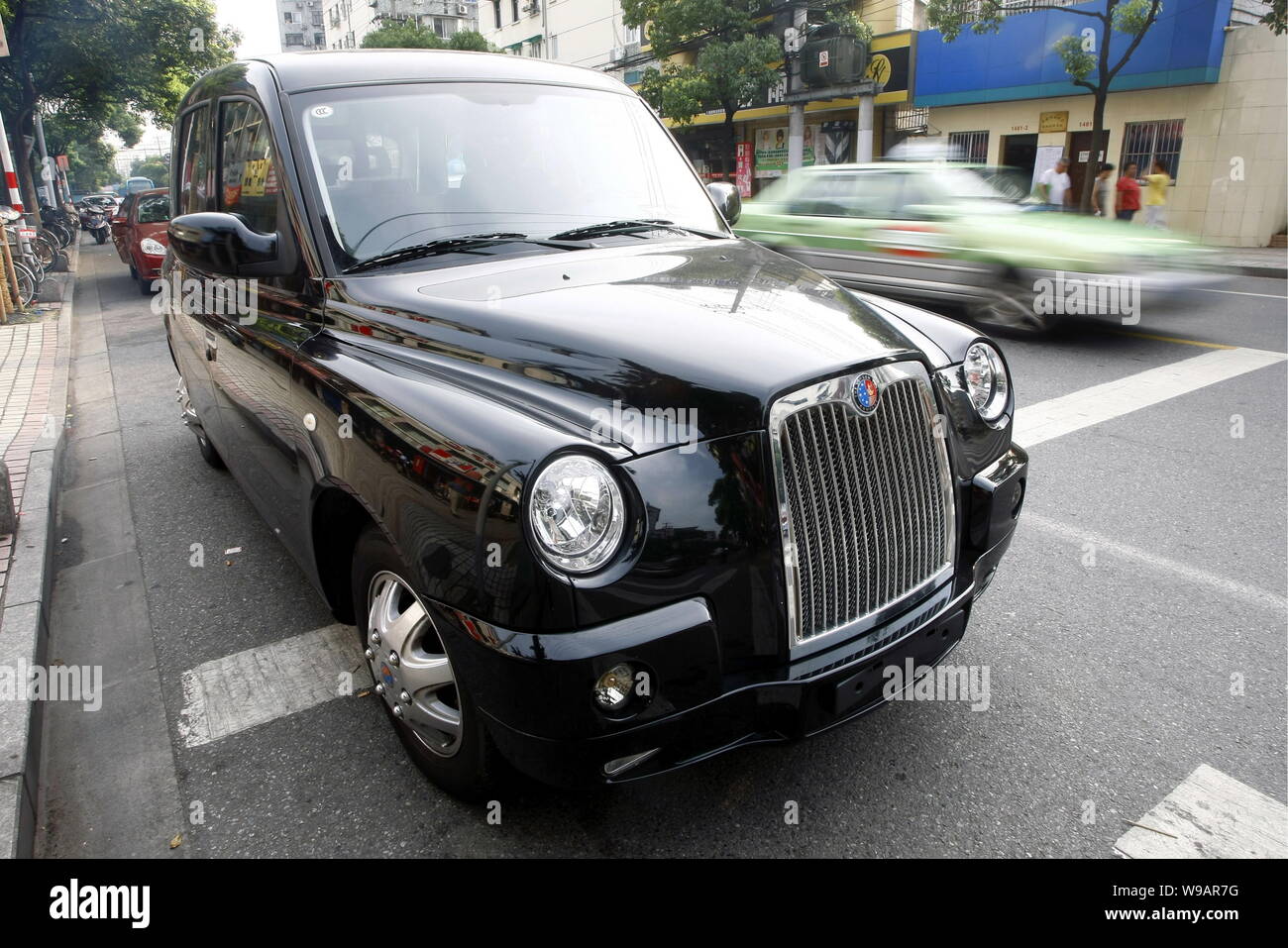 A Geely TX4 is seen in a street in Shanghai, China, July 21, 2010.   Manganese Bronze Holdings Plc, maker of the iconic London black cab, wanted to ti Stock Photo