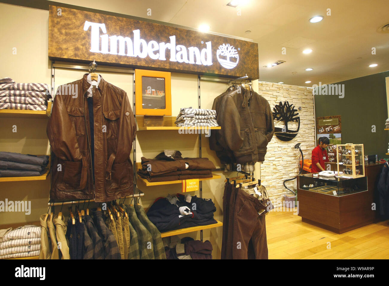 A Chinese staff is seen at a Timberland store at a department store in  Shanghai, China, November 11, 2010. Timberland Co. plans to at least double  s Stock Photo - Alamy