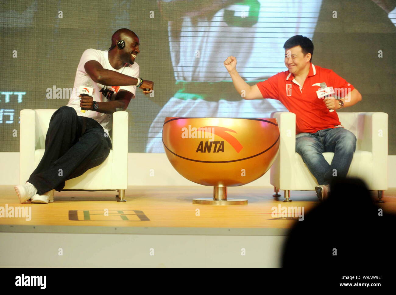 NBA basektball player Kevin Garnett of the Boston Celtics, left, and Zheng Jie, Executive Vice President of ANTA Sports Products Limited, greet each o Stock Photo