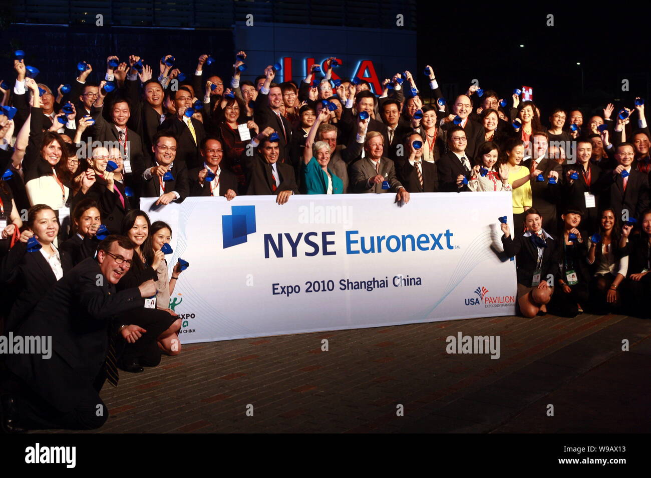 Delegates from NYSE Euronext and NYSE Euronext listed companies are seen during a bell ringing ceremony, to remotely open trading on New York Stock Ex Stock Photo