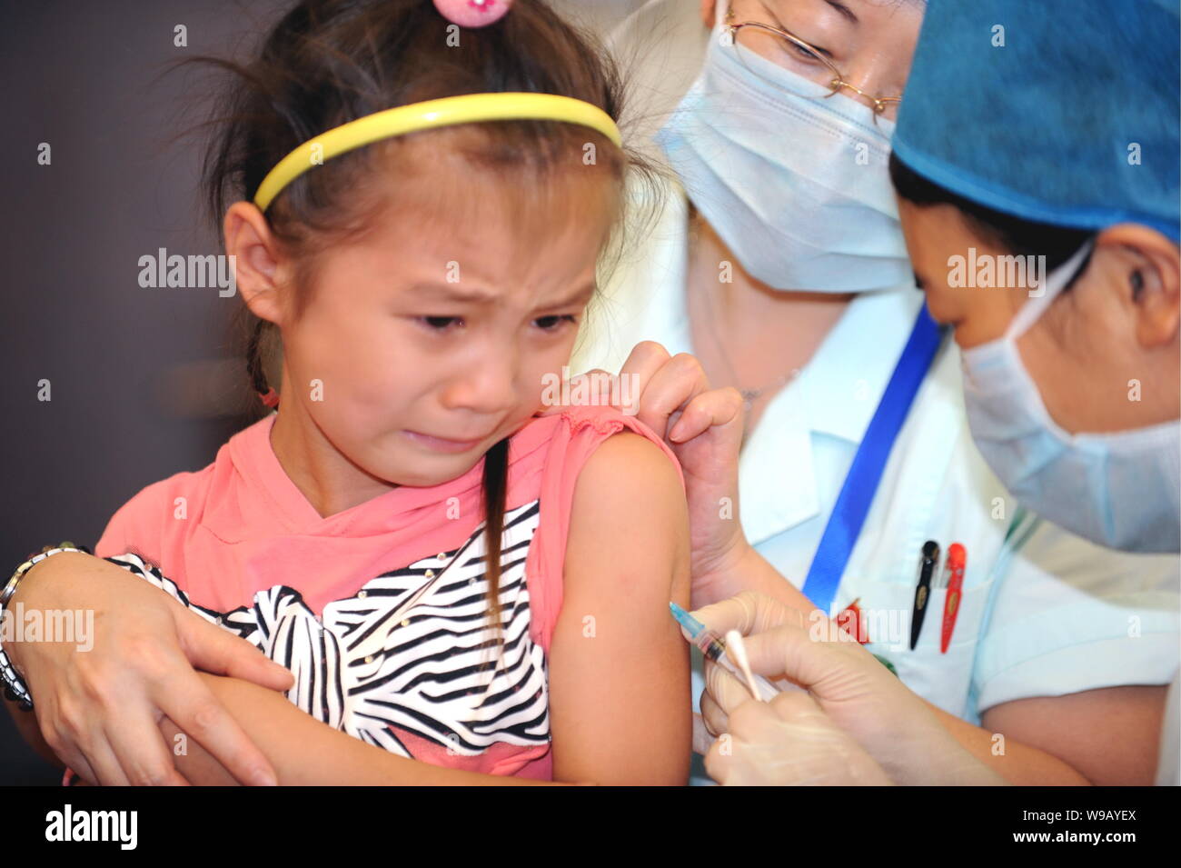 A Chinese Nurse Vaccinates A Young Chinese Girl Against Measles At A Disease Control Center In Beijing China September 13 2010 China Started A L Stock Photo Alamy