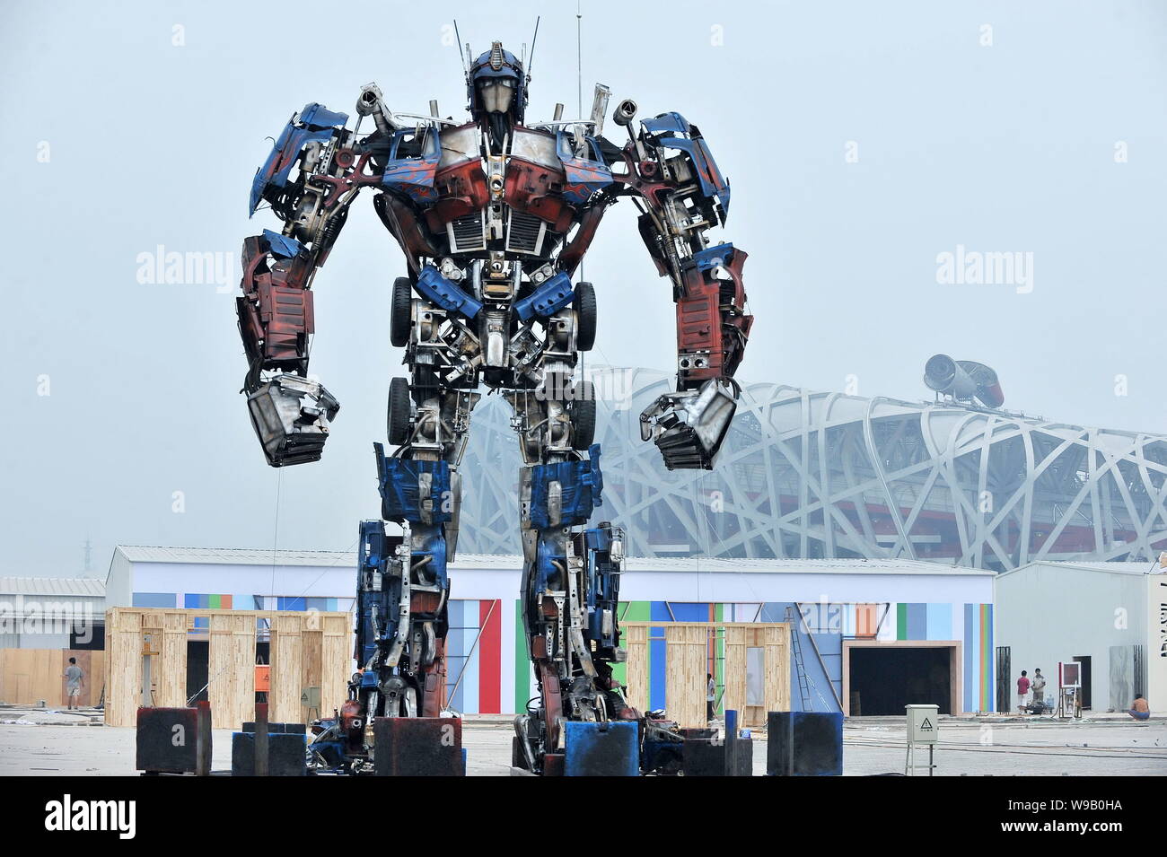 A replica of Optimus Prime, the leader robot of Autobots in the movie  Transformer, is displayed near the National Stadium, known as the Birds Nest,  in Stock Photo - Alamy