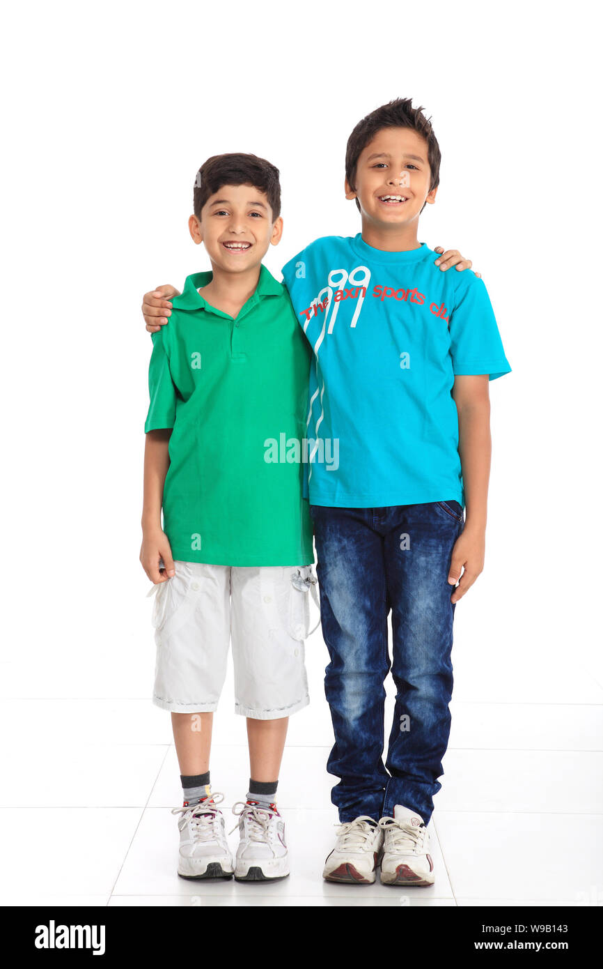 Two boys standing together and smiling Stock Photo