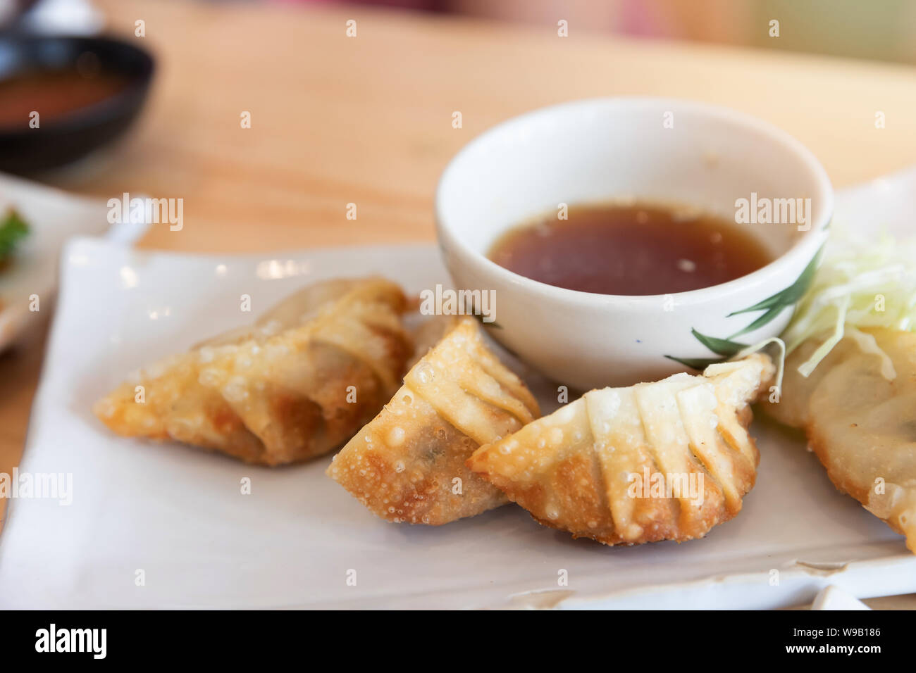 Close Up Of Fried Japanese Gyoza Dumplings With Soy Sauce Stock Photo Alamy
