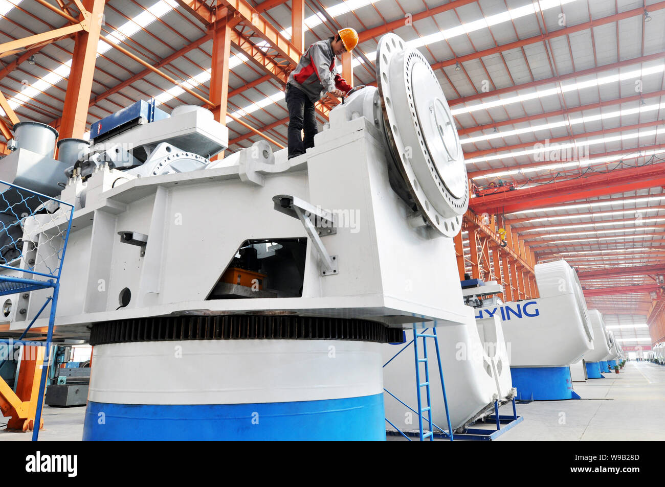 --FILE--A Chinese worker assembles a wind turbine in the plant of Shandong Changxing Group in Zouping county, Binzhou city, east Chinas Shandong provi Stock Photo