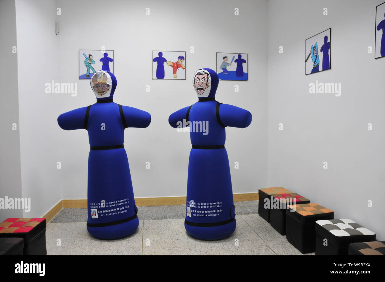 View of inflated mannequins for employees to slam to release their stress in a frustration venting room at the Foxconn Shenzhen plant in Shenzhen city Stock Photo