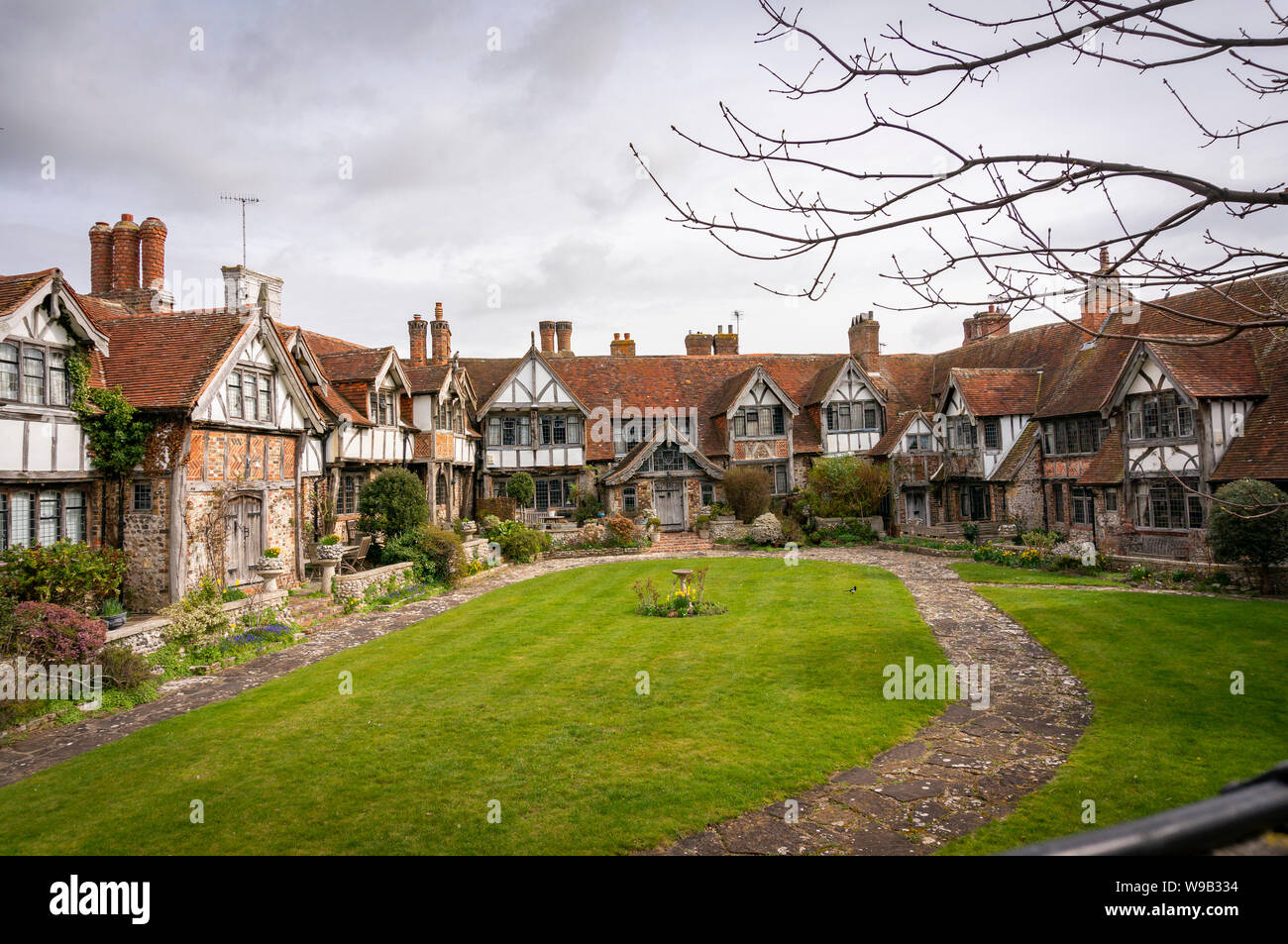 Old cottages or alms houses behind St. Margaret's Parish Church in Rottingdean, East Sussex, UK Stock Photo