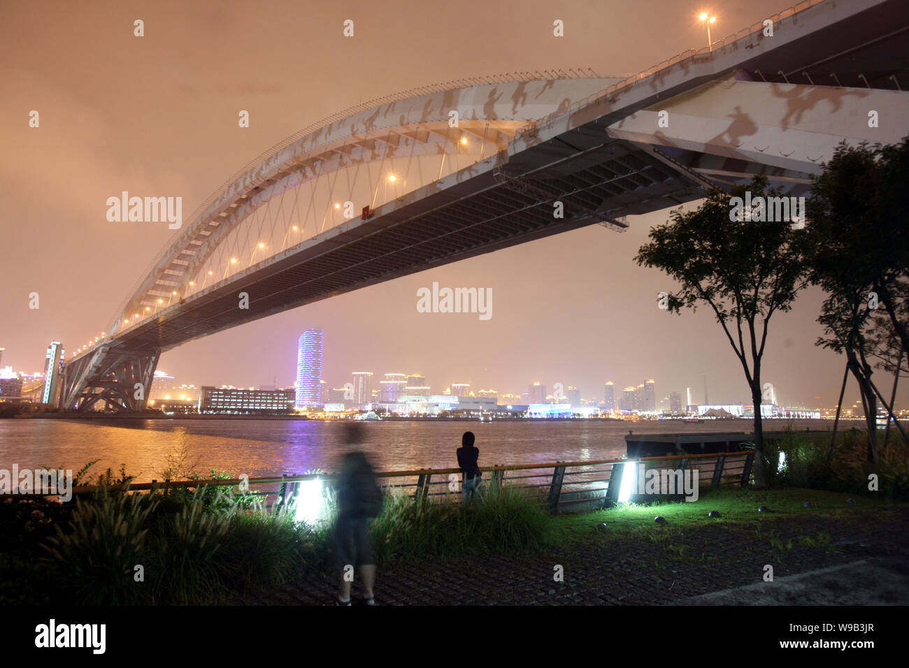 Signs illuminate the body of the Lupu Bridge over the Huangpu River in Shanghai, China, 13 September 2010.   The spectacular light show, lasting about Stock Photo