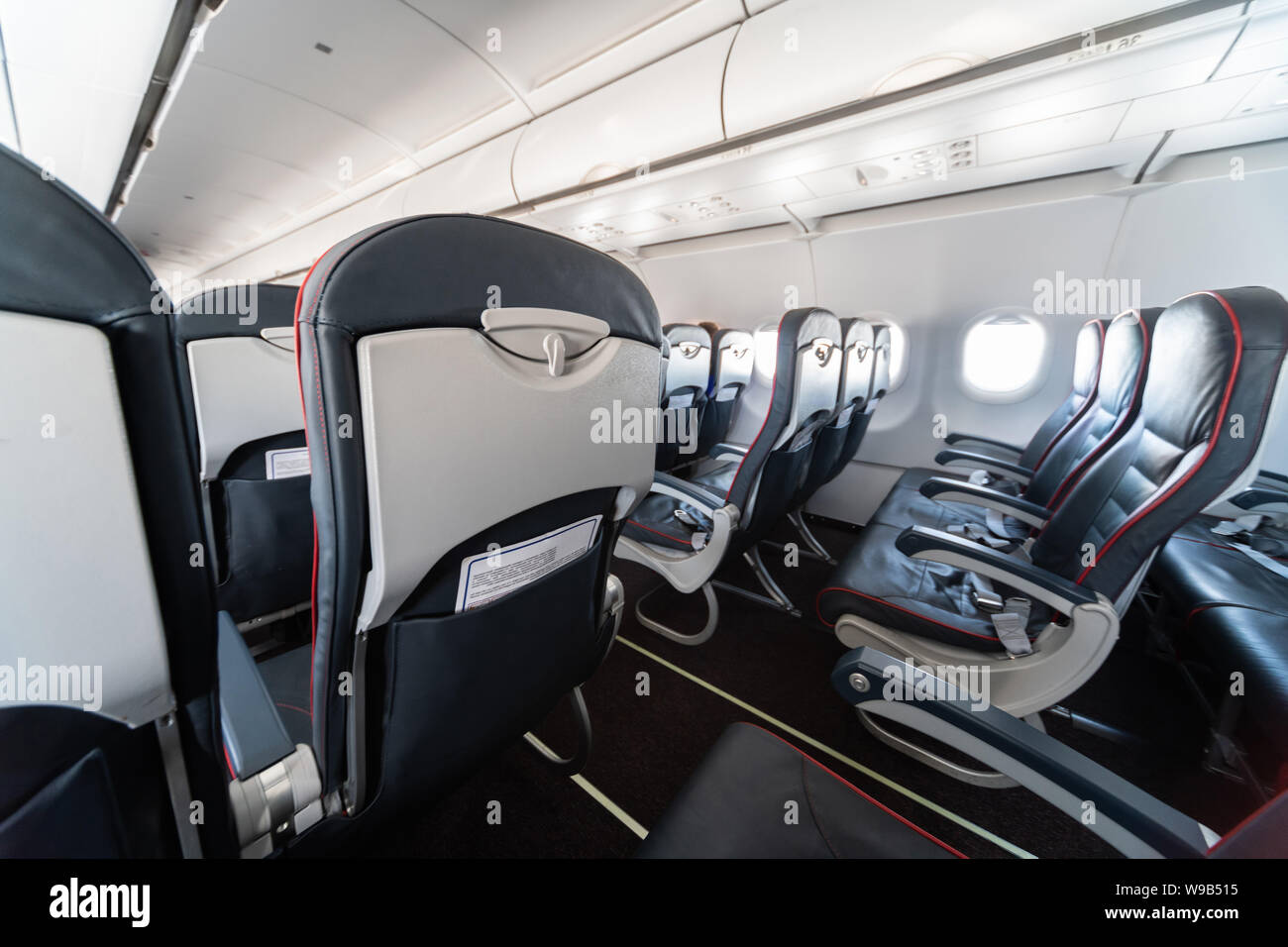 Airplane seats and windows. Economy class comfortable seats without
