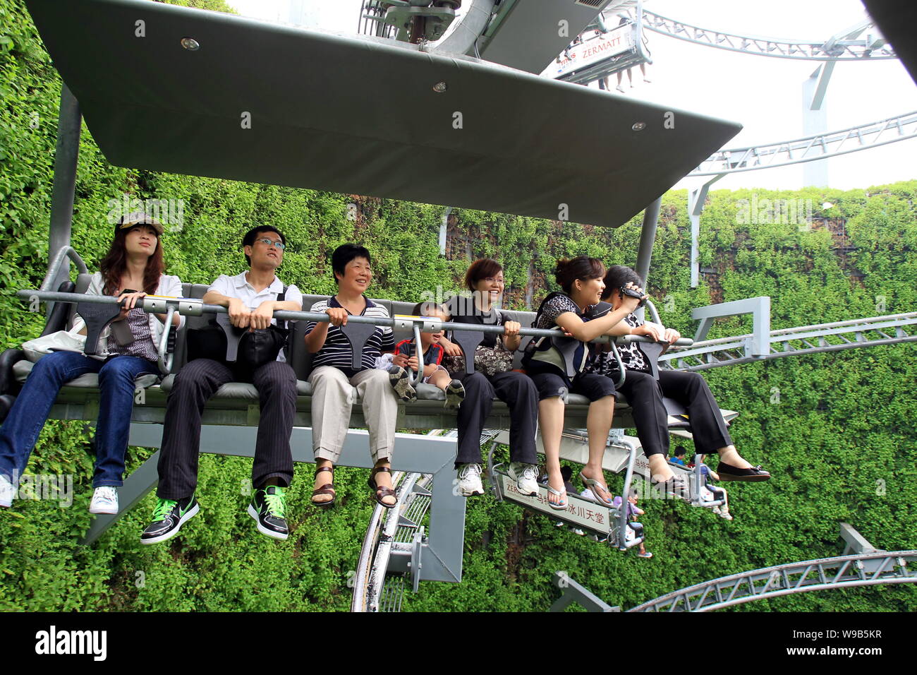 Visitors take the Titlis Mountain chair lift in the Swiss Pavilion in ...