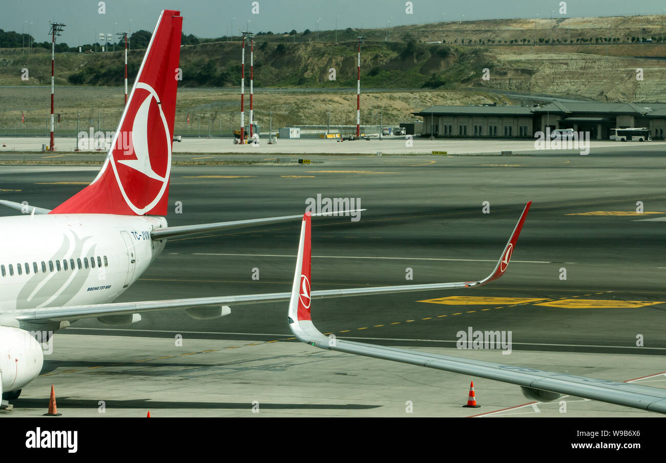 New Istanbul Airport, Istanbul / Turkey - August 11th, 2019 : Turkish Airlines TC JVN and another airplane side by side at Istanbul New Airport. Stock Photo