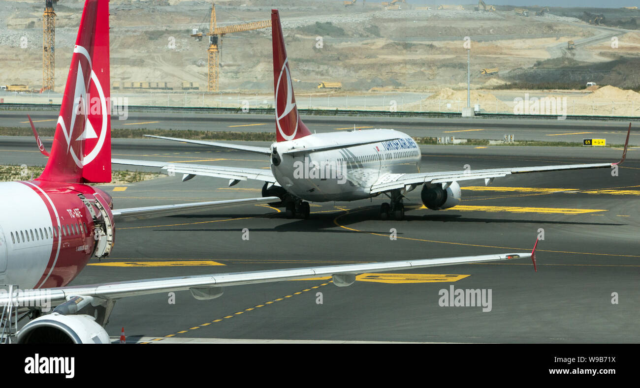 New Istanbul Airport, Istanbul / Turkey - August 11th, 2019 : Local competitors Atlas Global Airlines and Turkish Airlines planes at New Istanbul Airp Stock Photo