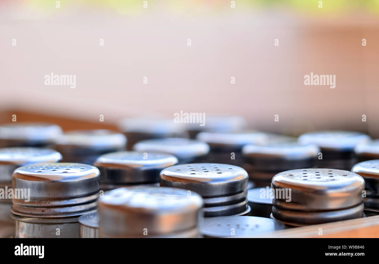 Group of shakers for restaurant usage with selective focus on one raw