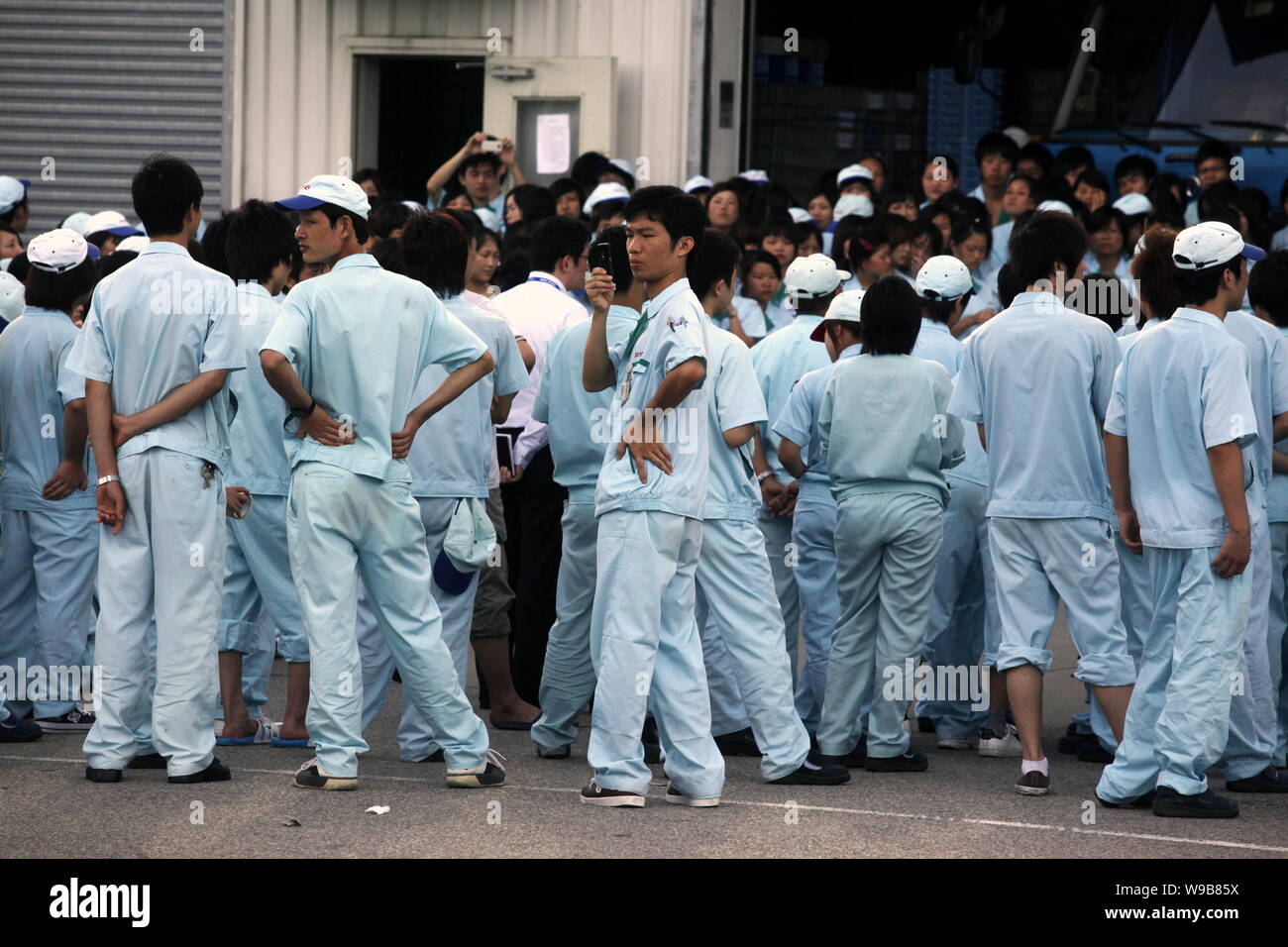 Chinese factory workers strike to demand higher wages at the factory of  Denso (Nansha) Co Ltd, a supplier of Toyota Motor, in Guangzhou, south  Chinas Stock Photo - Alamy