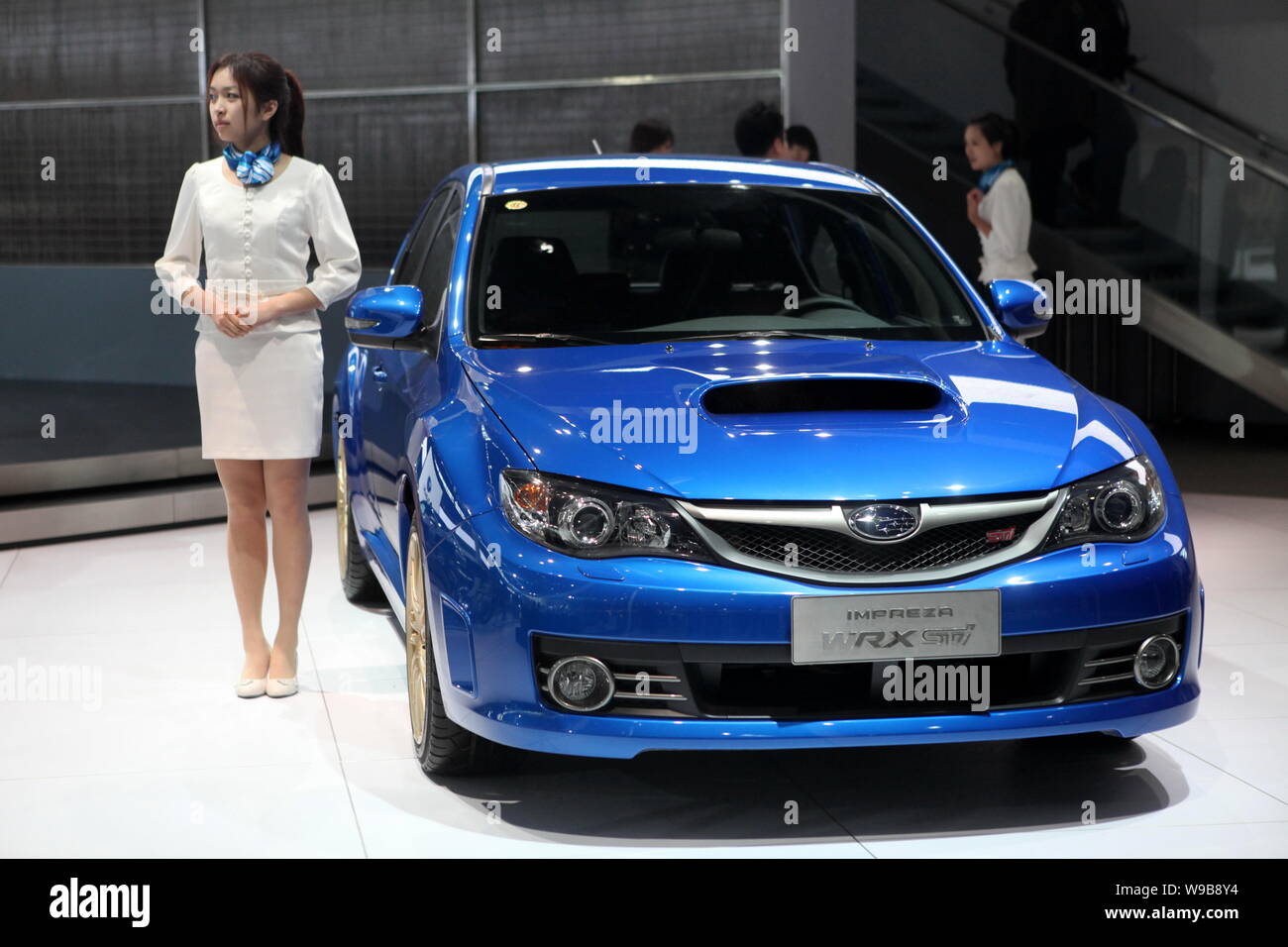 A Model Poses Next To A Subaru Impreza Wrx Sti During The Preparation For The 11th Beijing International Automotive Exhibition Known As Auto China Stock Photo Alamy