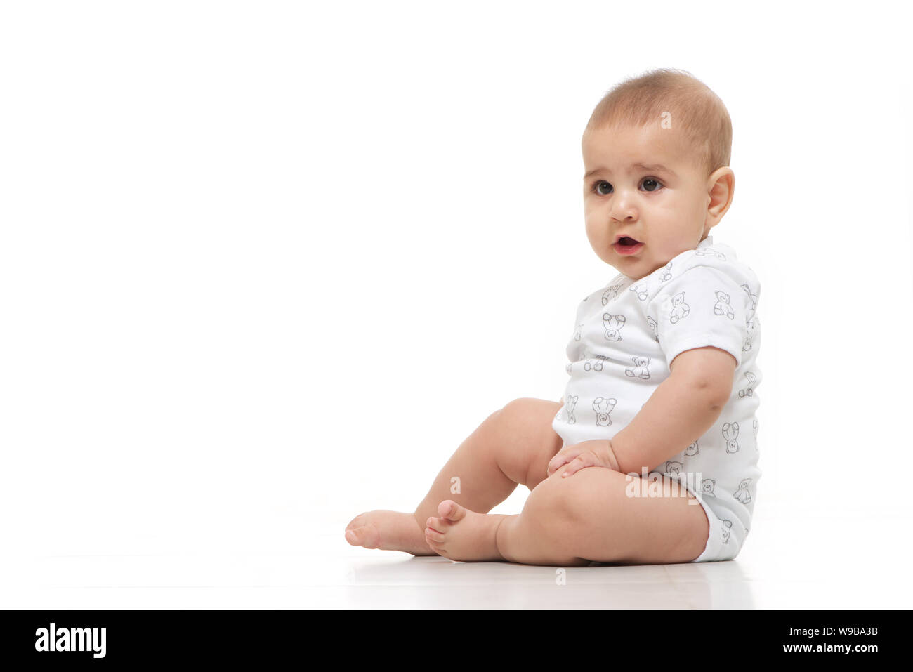 Boy sitting floor side view hi-res stock photography and images - Alamy