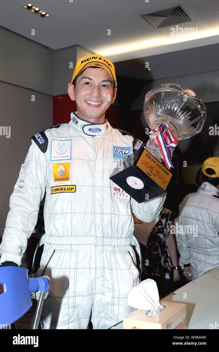 Hong Kong actor Carlo Ng holds a trophy cup during the One Foundation  Celebrity Charity Race at Shanghai International Circuit (SIC) in Shanghai,  Chin Stock Photo - Alamy