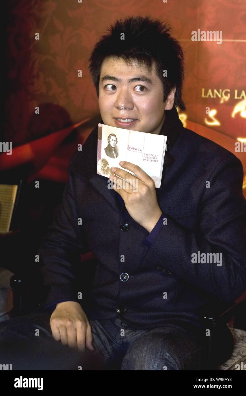 Chinese pianist Lang Lang poses with the Chopins Passport during a