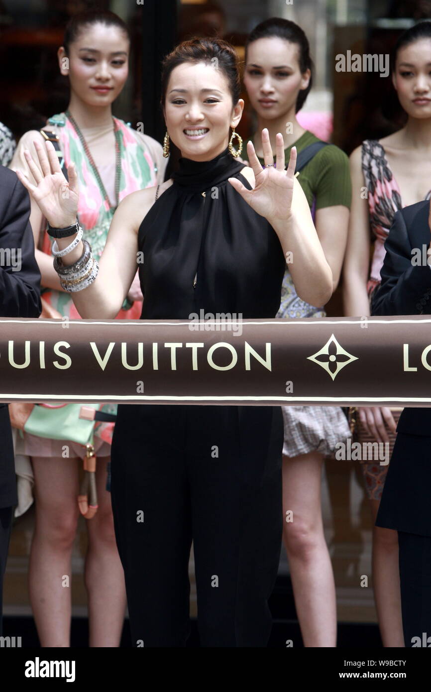 Chinese actress Gong Li waves during the opening ceremony for the