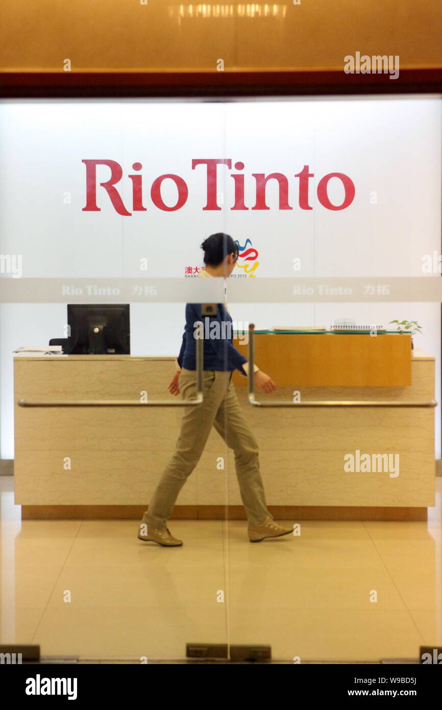 File An Employee Walks Past The Front Desk At The Shanghai Office