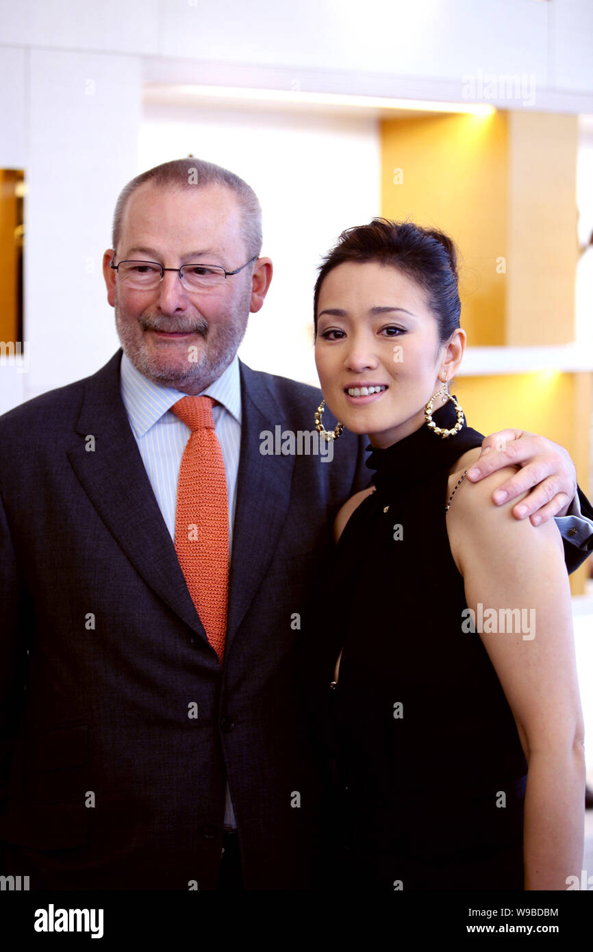 Patrick Louis Vuitton, a fifth-generation family member of Louis Vuitton,  and Chinese actress Gong Li pose at the newly-opened Louis Vuitton flagship  Stock Photo - Alamy