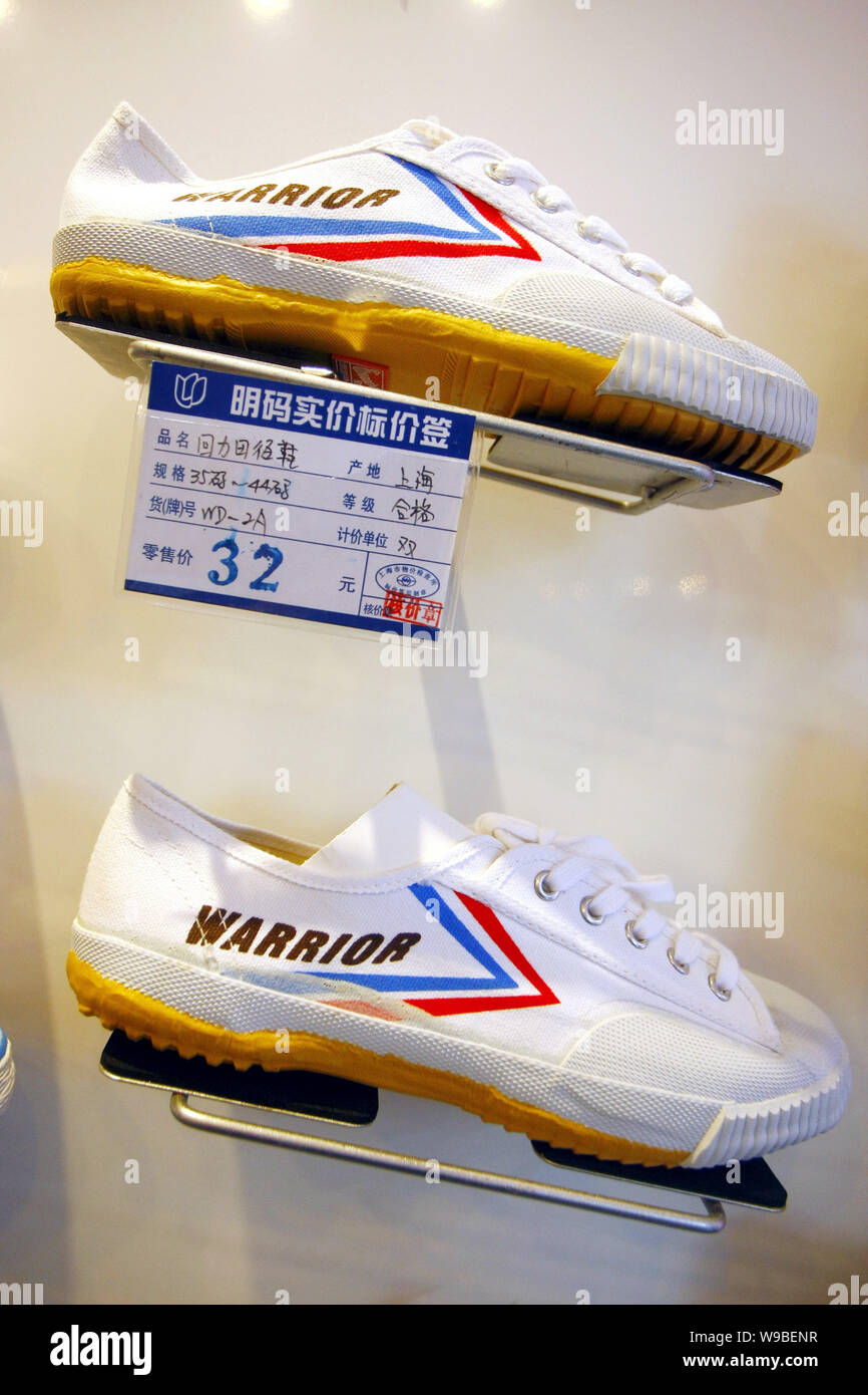 Old-fashioned sneakers are displayed in a flagship shoe store of Warrior,  better known as Huili in China, in Shanghai, China, 18 September 2010. Hui  Stock Photo - Alamy