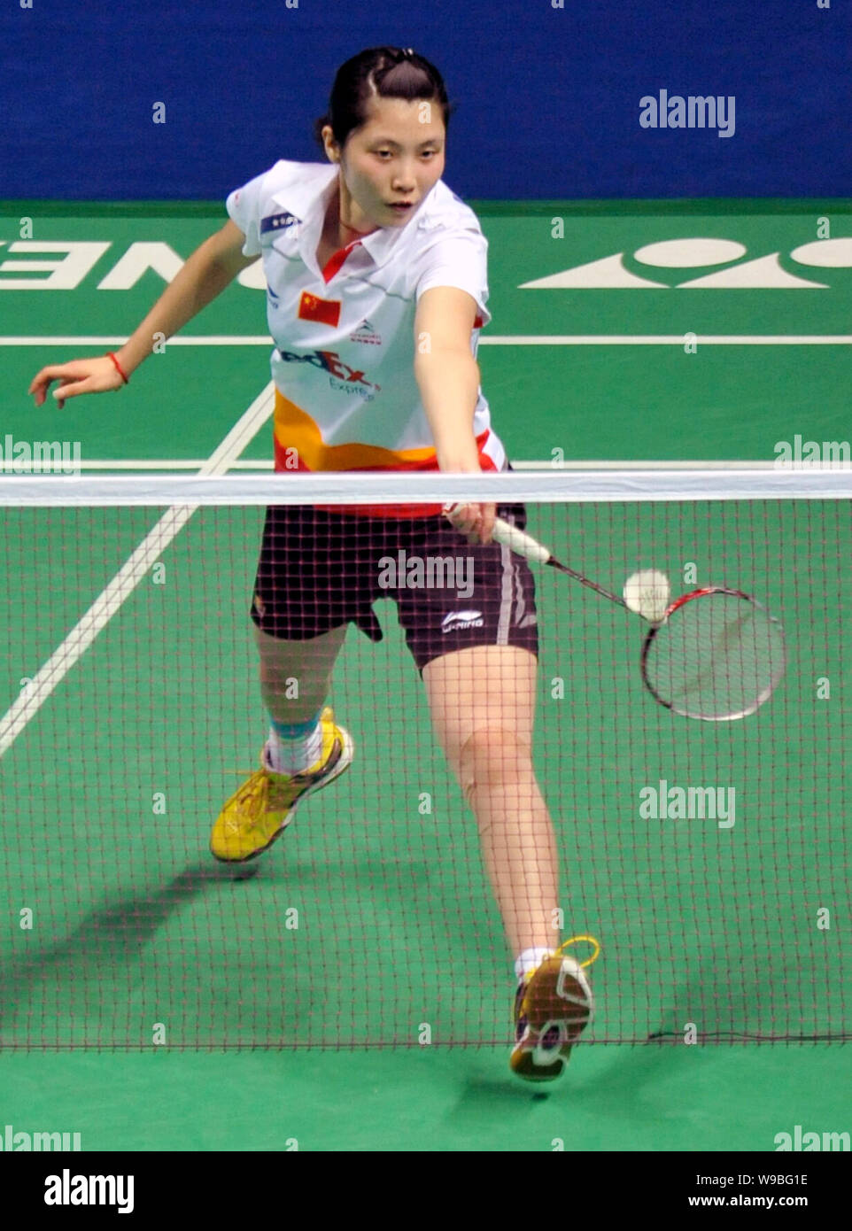 Chinas Jiang Yanjiao competes in the final of the womens singles at the China Open Badminton Championships 2010 in Shanghai, China, December 5, 2010. Stock Photo