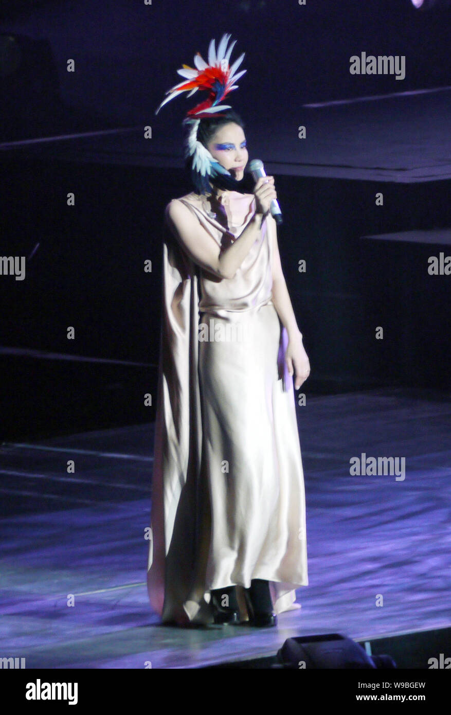 Chinese singer and actress Faye Wong performs at her concert in Shanghai, China, November 27, 2010. Stock Photo