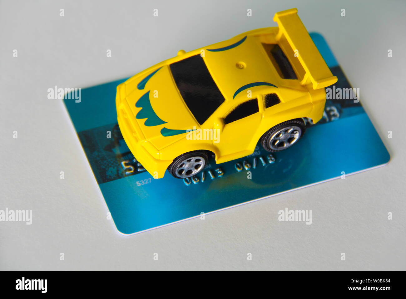Toy car on a credit card Stock Photo Alamy