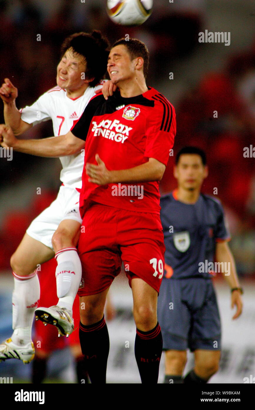 Pierre Michel Lasogga Front Right Of Bayer 04 Leverkusen Football Club Vies With Pu Cheng Of The Chinese Olympic Football Team During A Friendly Soc Stock Photo Alamy