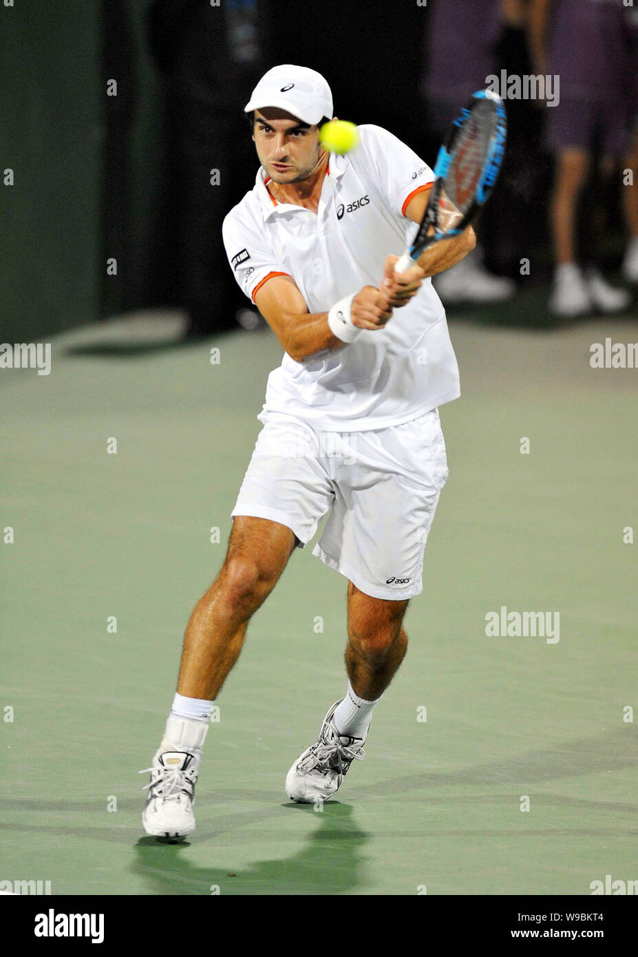 Florent Serra of France competes against Juan Monaco of Argentina in their first round of the mens singles of the 2010 Shanghai Rolex Masters in Shang Stock Photo