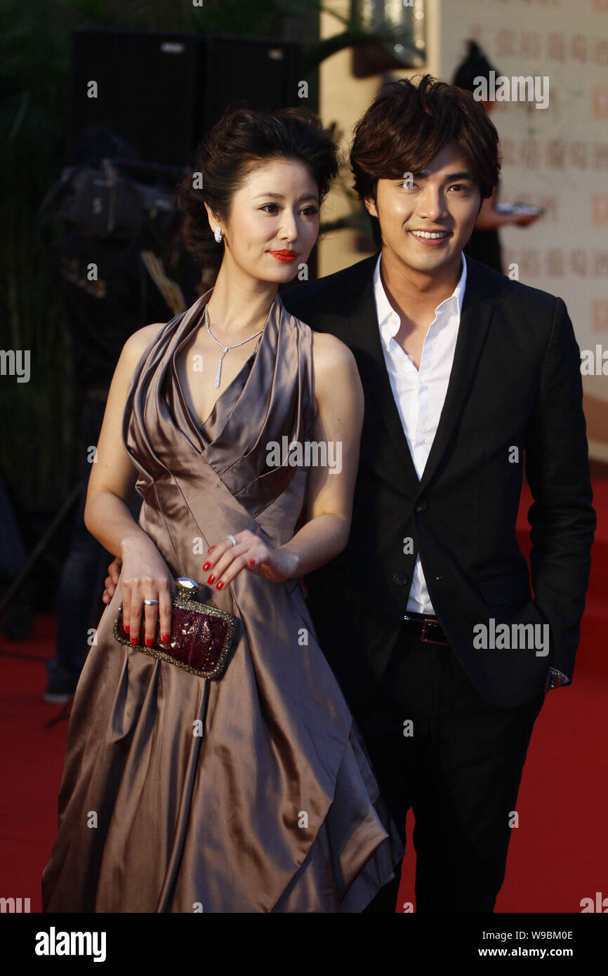 Taiwanese actress Ruby Lin and actor Mike He pose on the red carpet prior to the opening ceremony of the 13th Shanghai International Film Festival in Stock Photo