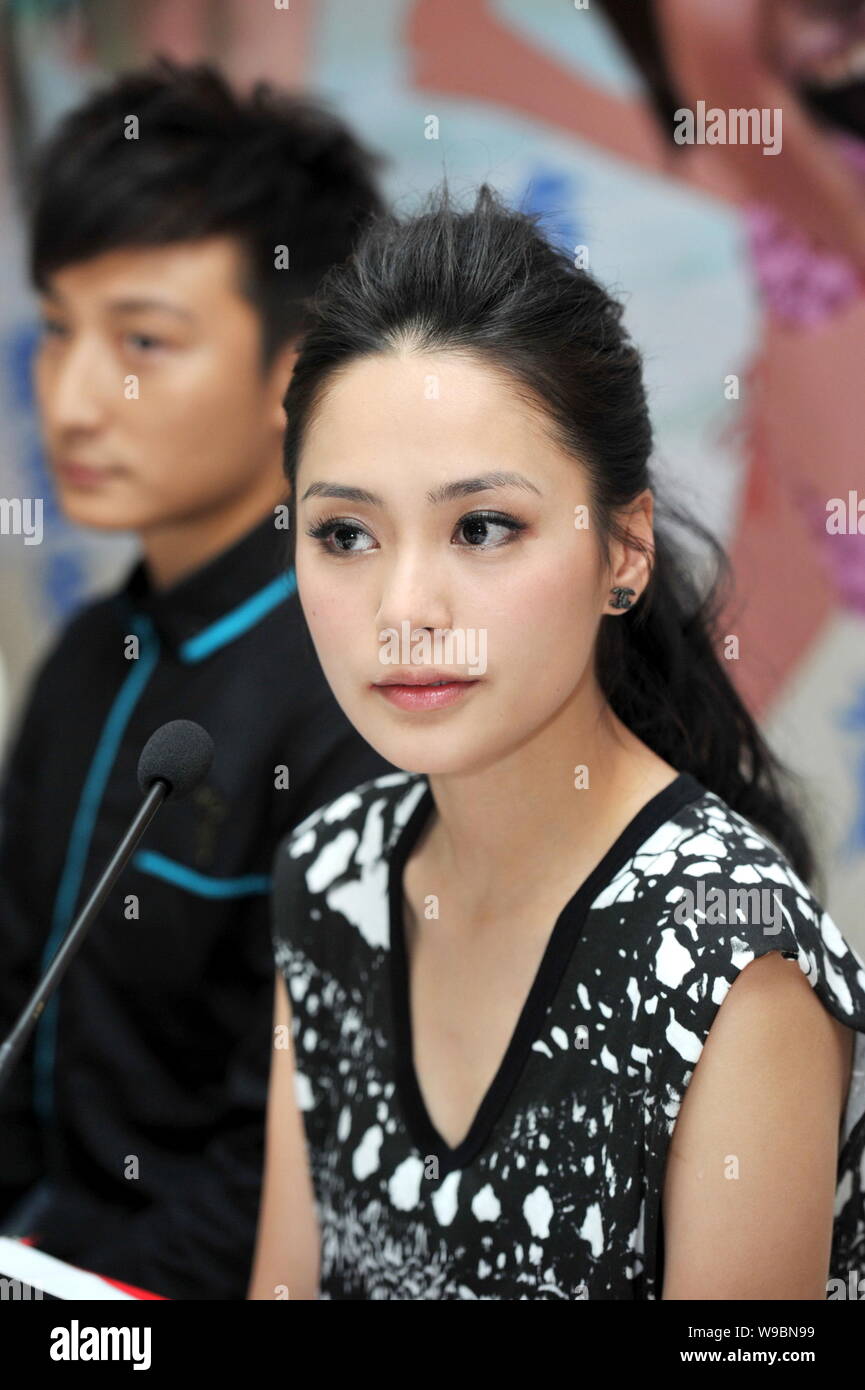 Hong Kong singer and actress Gillian Chung (Chung Yantung), front, and actor Alex Fong are seen