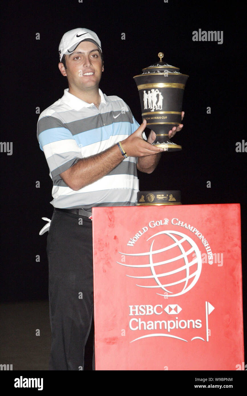 Italian golfer Francesco Molinari holds his trophy during the award