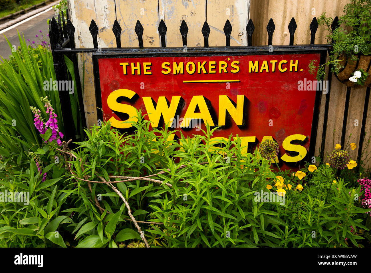 UK, England, Devon, Staverton Station on South Devon Railway, Old Swan Vestas match enamel advertising sign on platform Stock Photo