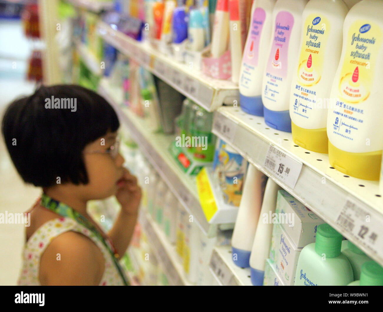 FILEA Chinese child looks at bottles of Johnsons baby products