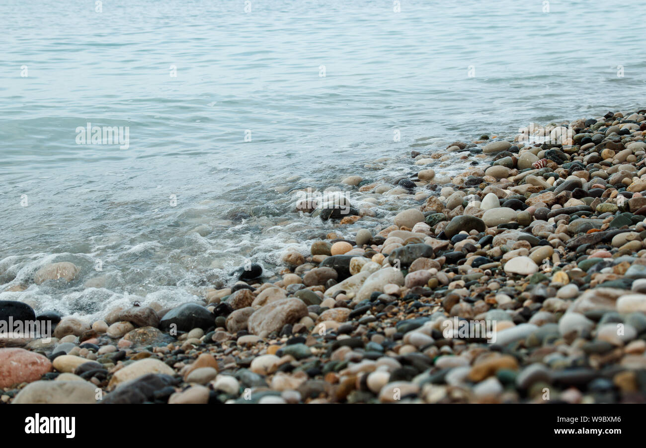 Waves on sea shore. Ripple of water near shoreline. Stone sea shore ...