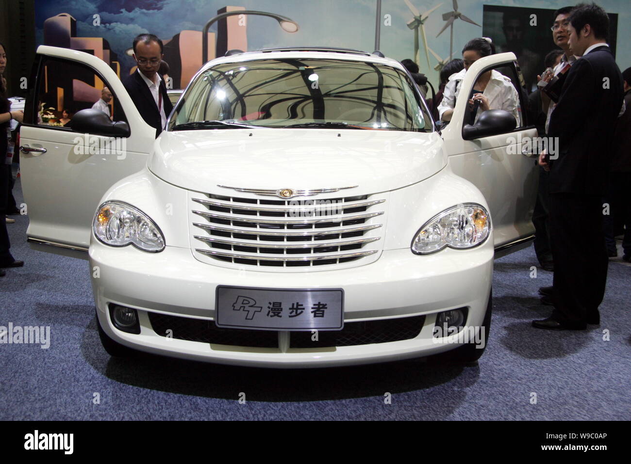 --FILE--Visitors look at a Chrysler PT Cruiser on display at the 13th Shanghai International Automobile Industry Exhibition, known as Auto Shanghai 20 Stock Photo