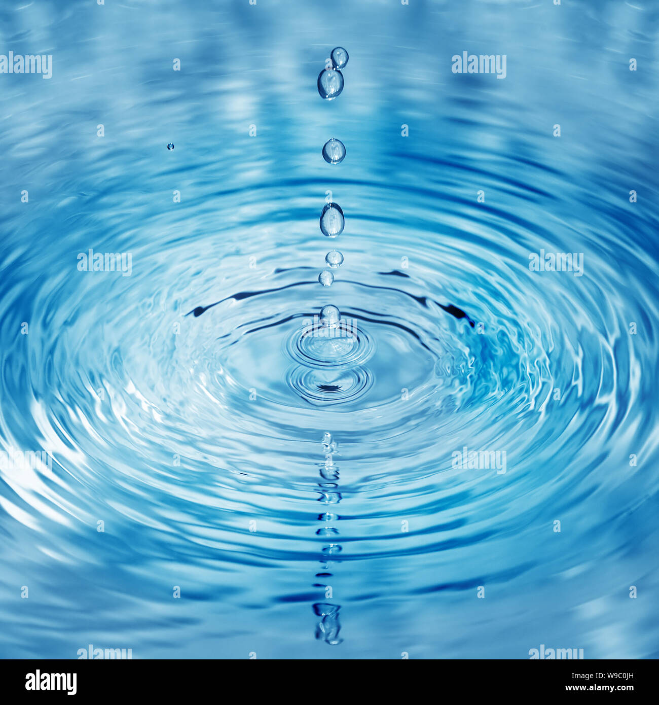 Falling into water droplets Stock Photo - Alamy