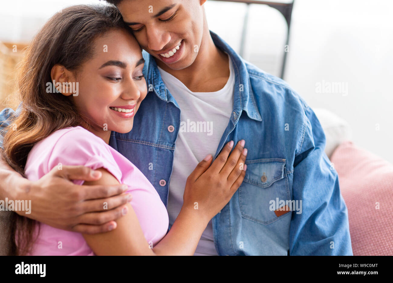 Romantic moment. Dreamy teen couple cuddling each other Stock Photo