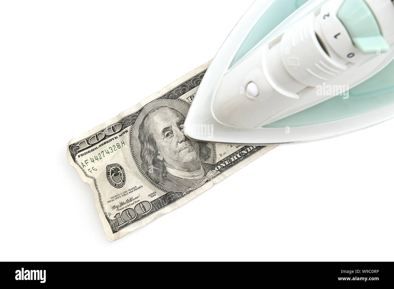 Ironing of dollars isolated on white background Stock Photo Alamy