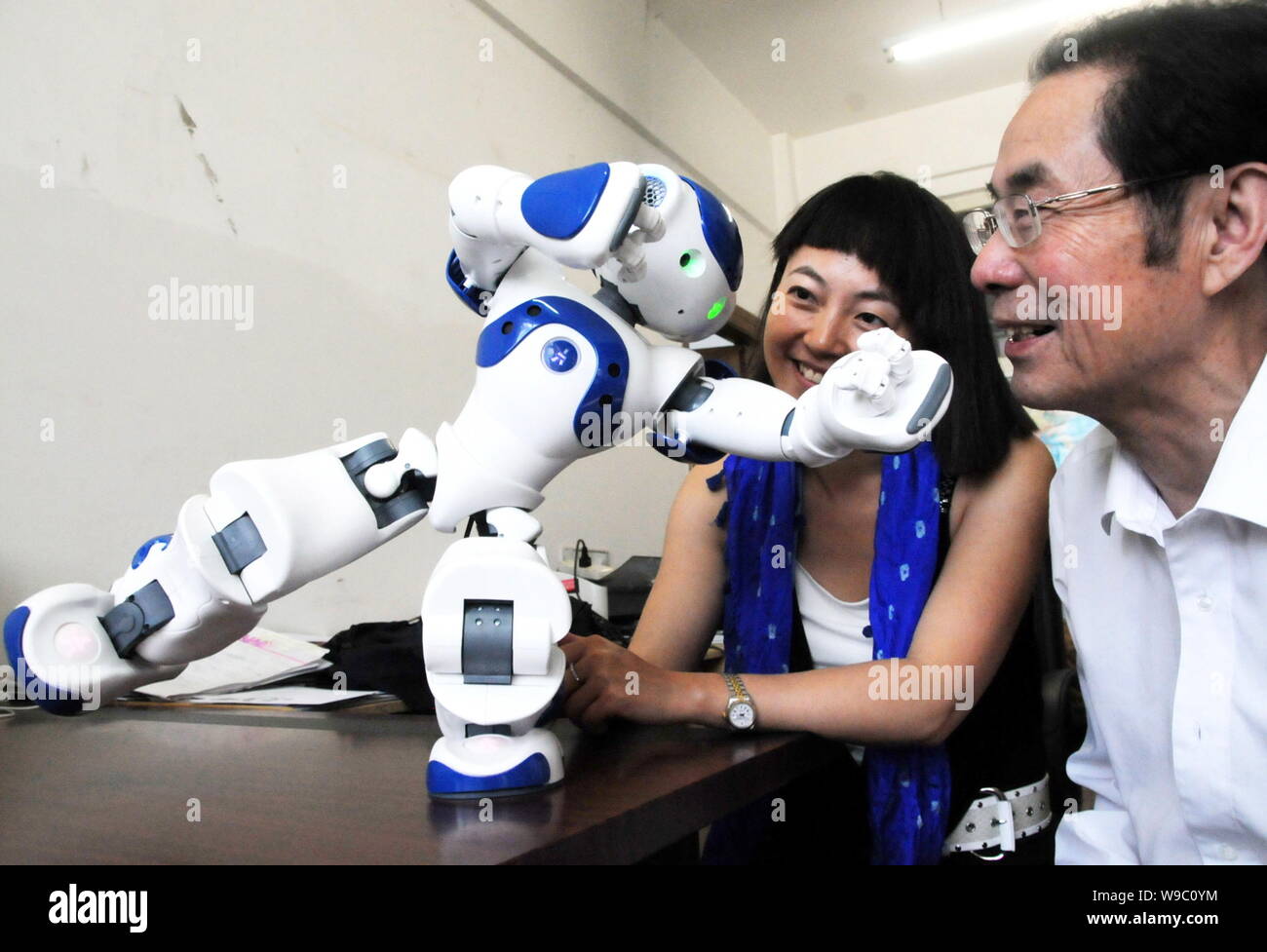 Professor Hong Bingrong, right, Vice President of Federation of International Robot-soccer Association(FIRA) and President of FIRA China Branch, and a Stock Photo
